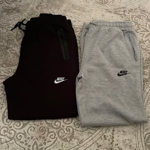 Women’s Nike sweatpants. Brand new One pair of black. One pair gray.